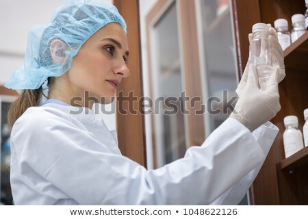 Stok fotoğraf: Woman Chemist Finding The Perfect Substance During Experimental