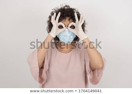 Stockfoto: Young Beautiful Funny Cheerful Female Doctor In Medical Mask And Sterile Gloves On White Background