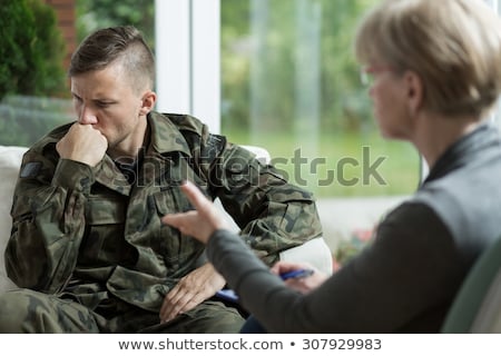 Stok fotoğraf: Doctor And Military Officer At Psychotherapy Treatment