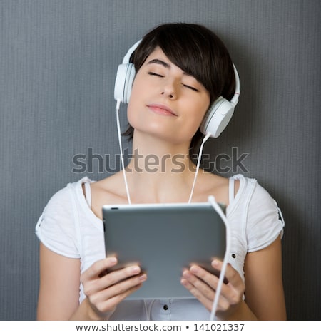 ストックフォト: Young Girl Immersed In Listening To Her Music