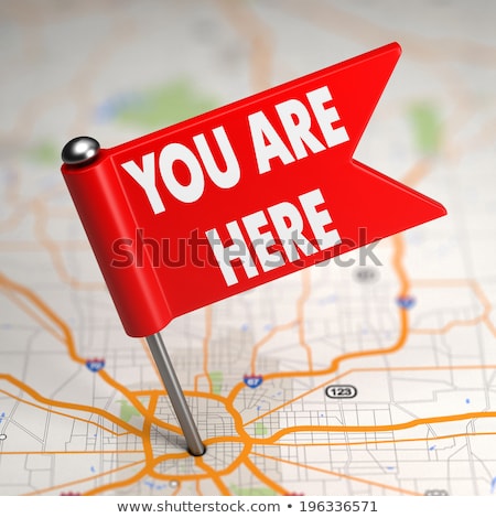 [[stock_photo]]: We Are Here - Small Flag On A Map Background