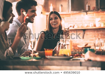 [[stock_photo]]: Young Friends Enjoying Meal At Home