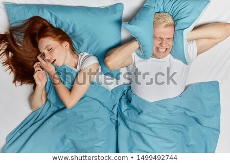 Stockfoto: Woman Covering His Ears With Pillow