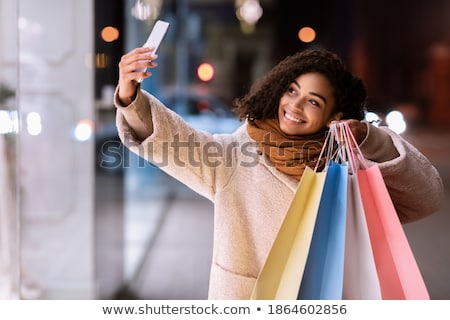 Foto stock: African Young Woman Standing Posing Outdoors Winter Concept Drinking Coffee