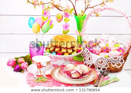 Stock fotó: Easter Eggs In Basket Plates Cutlery And Flowers
