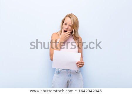 ストックフォト: Image Of Displeased Blonde Woman Holding Placard And Expressing Shock