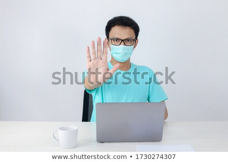 Stock fotó: Young Asian Man Wear Hygienic Mask Is Scared Or Panicking With Gesturing Stop Hand Afraid Of Corona