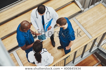 Foto stock: Overhead View Of Woman In Stairwell
