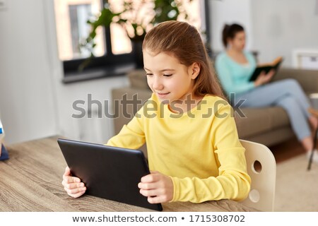 Stockfoto: Family - Child Reading An E Book