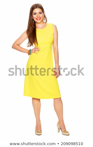 Stock photo: Smiling Young Brunette Woman In Yellow Dress Isolated
