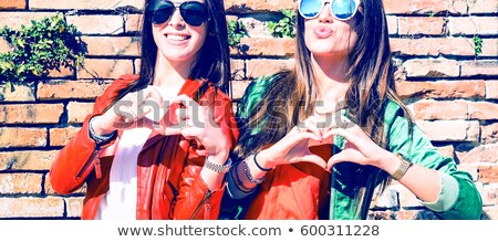 Stockfoto: Lesbian Couple Making Heart Shape With Hands