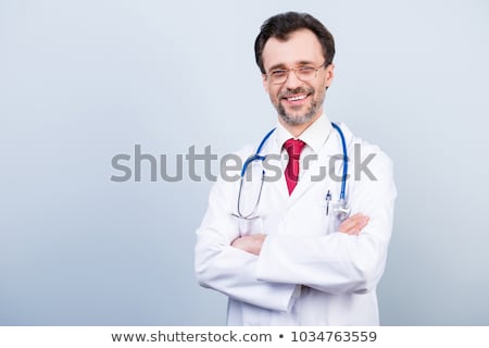 Сток-фото: Happy Male Doctor Standing With Arms Folded