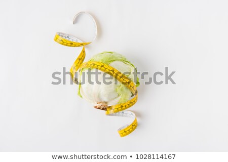 Foto stock: Raw Green Round Lettuce With Measuring Tape Isolated On White Background