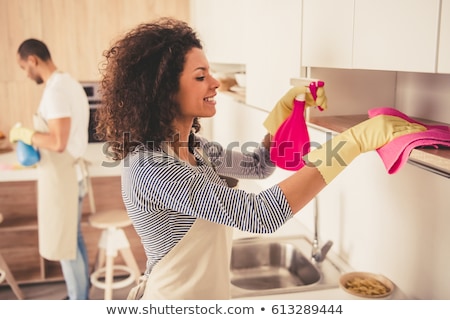 Foto stock: Woman Or Housewife Cleaning Table At Home Kitchen
