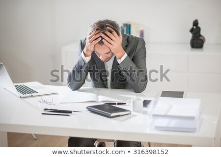 Stockfoto: Businessman Holding Glassesand Having An Idea