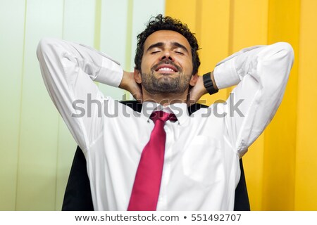 Stok fotoğraf: Businessman Relaxing On His Chair After An Hard Working Day