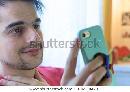 Foto stock: Close Up Of Happy Male Couple With Gay Pride Flags