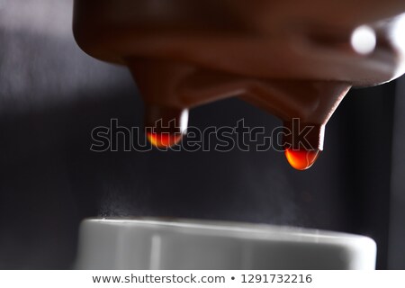 Macro Photo Of Making Coffee In The Coffee Machine Drops Of Coffee Dripping Into The Cup Сток-фото © artjazz