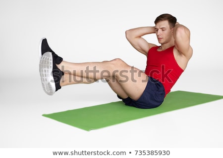 Сток-фото: Young Sportsman Doing Abdominal Exercises