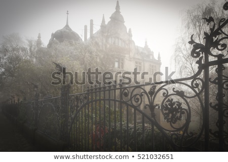 Сток-фото: Old Villa With Iron Fence In Morning Fog