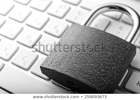 Stok fotoğraf: Security Lock On White Computer Keyboard