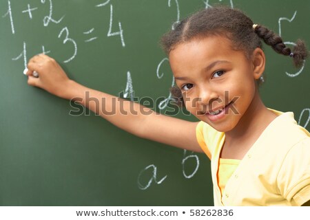 Portrait Of A Girl And A Blackboard Of Sums Stockfoto © Pressmaster