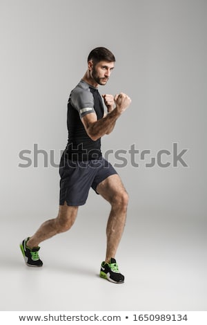 Foto stock: Sportsman Fighter Isolated Over Grey Wall Background