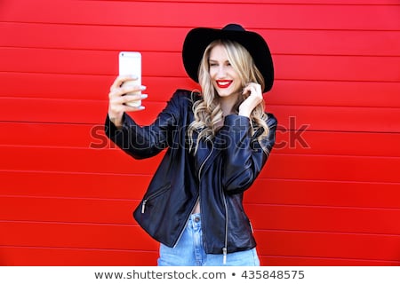 Stockfoto: Portrait Of A Blonde In A Black Hat