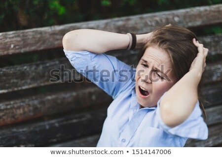 Terrified Woman Holding Her Head With Both Hands Zdjęcia stock © Madrolly