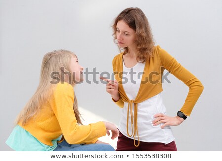 ストックフォト: Mother Daughter Interaction Of Girl Explaining Something