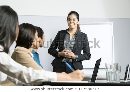 [[stock_photo]]: Indian Speaker Doing Business Presentation