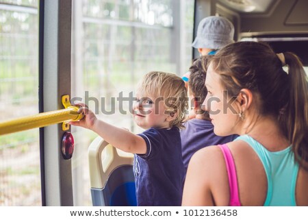 Stock foto: Mom And Son Go By Bus Traveling With Children Concept