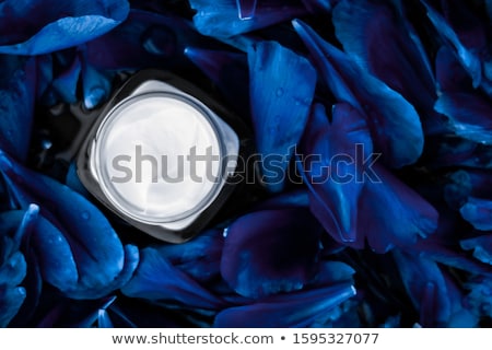 Stock photo: Luxury Face Cream Moisturizer For Facial Skin On Blue Flower Bac