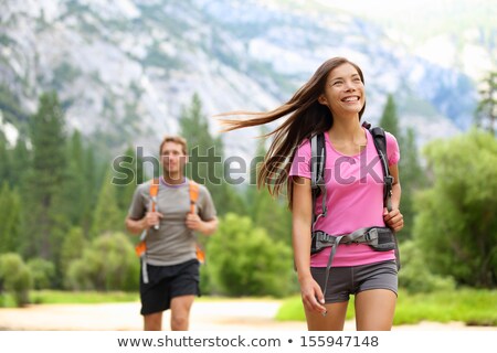 Сток-фото: Interracial Couple Hiking In The Forest