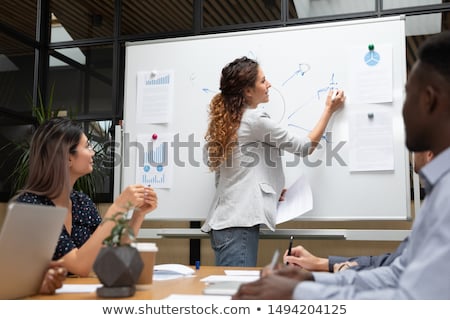 [[stock_photo]]: Young Woman Drawing On Whiteboard