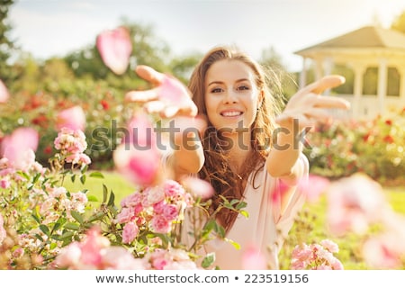 Stock photo: Rose Petals And A Woman Face