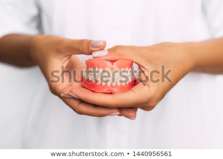 Foto stock: Dentures In Hand