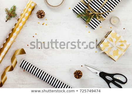 Stockfoto: Rolls Of Golden Wrapping Paper For Gifts