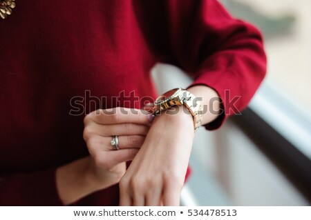 Stock photo: Attractive Woman Checking The Time
