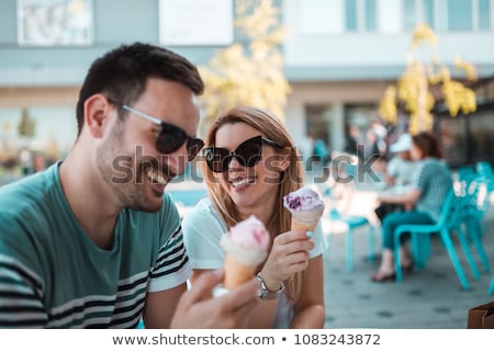 Stock fotó: Man And Woman Sitting Eating Ice Cream