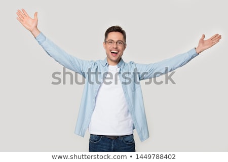 Stock foto: Smiling Casual Man With Eyeglasses Is Welcoming