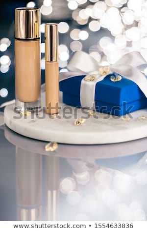 Stock photo: Holiday Make Up Foundation Base Concealer And Blue Gift Box Lu