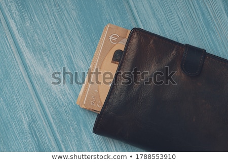 Foto stock: Close Up Of Black Wallet With Euro Money