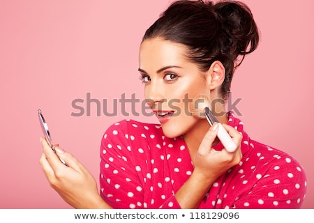 Stock photo: Young Woman Applying Blusher