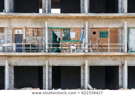 Stockfoto: Rotten Shell Of Building Without Construction Permit