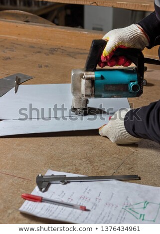 Stock photo: Craftsman Cutting Metal With Shear