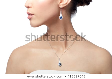 [[stock_photo]]: Close Up Of Beautiful Woman Neck With Pendant