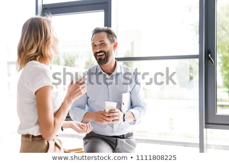 Сток-фото: Businesswoman Flirting With Colleague