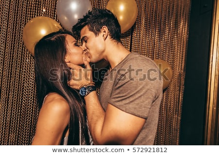 Foto stock: Passionate Romantic Young Couple Kissing And Embracing In A Green Park