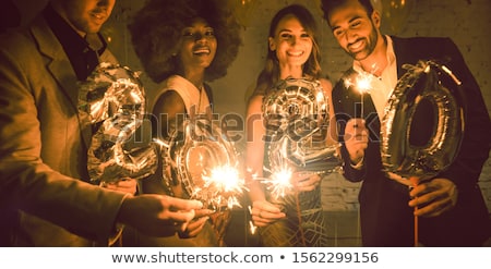 Stockfoto: Group Of Party People Celebrating The Arrival Of 2020